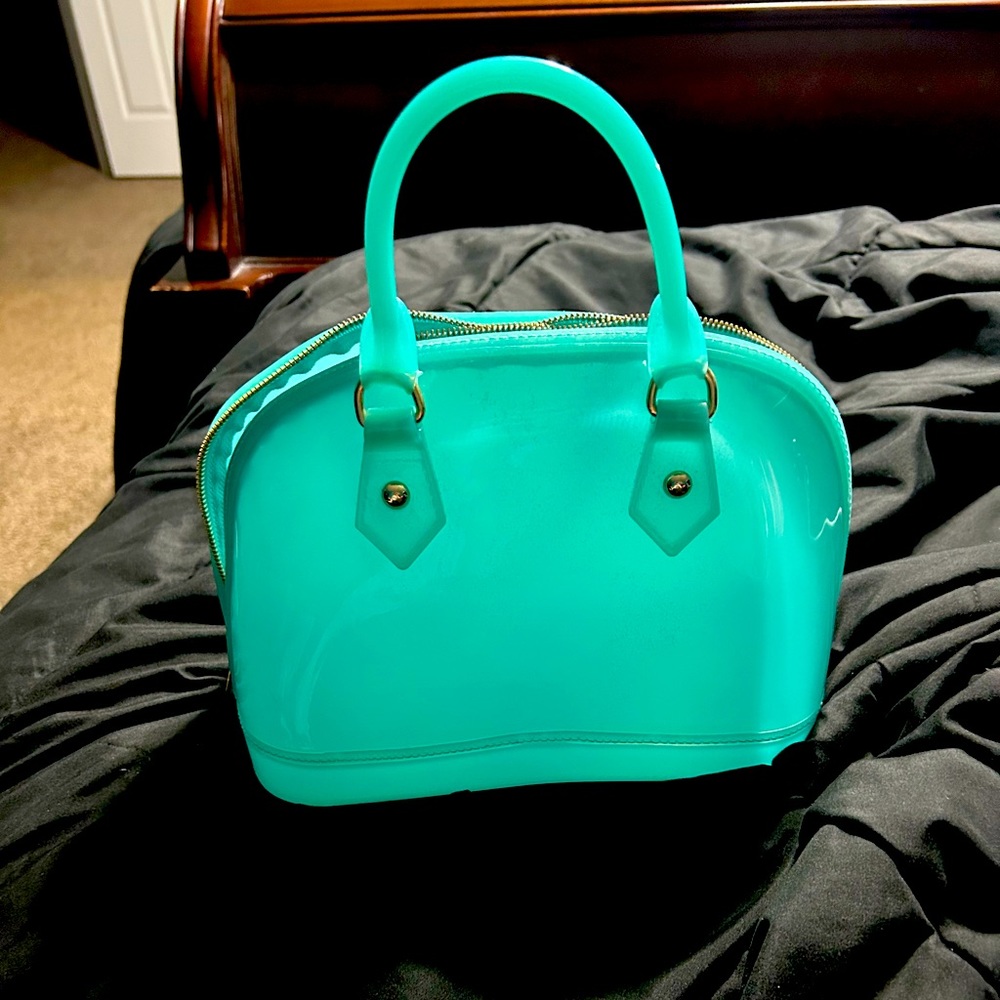 Last Chance Donating next week. Mini jelly teal handbag.